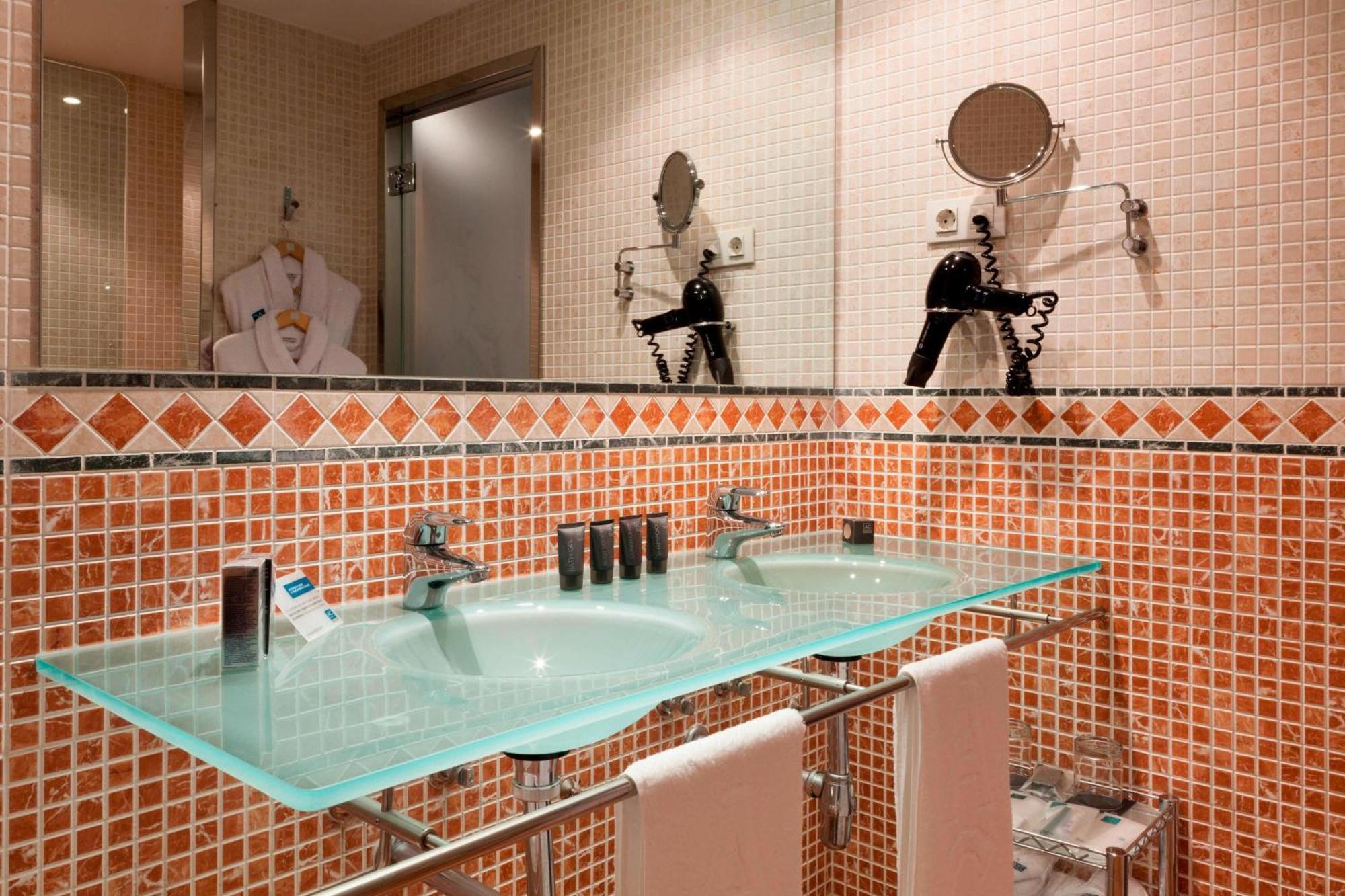 Ac Hotel Palacio De Santa Ana By Marriott Valladolid Exterior photo Bathroom with glass countertop